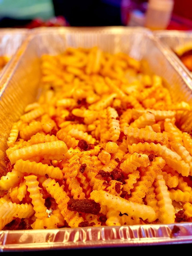 Crispy crinkle-cut fries seasoned with hushpuppy crumbs