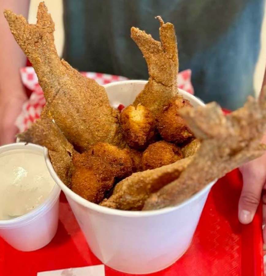 Catfish bucket — six whole catfish with family sides and hushpuppies