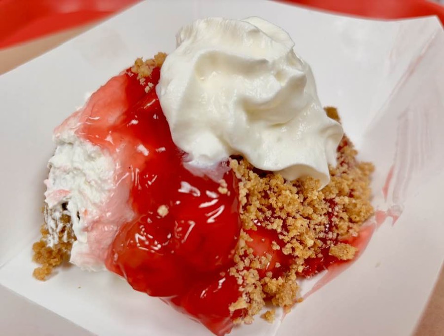 Redneck cheesecake cup with cherry topping and whipped cream